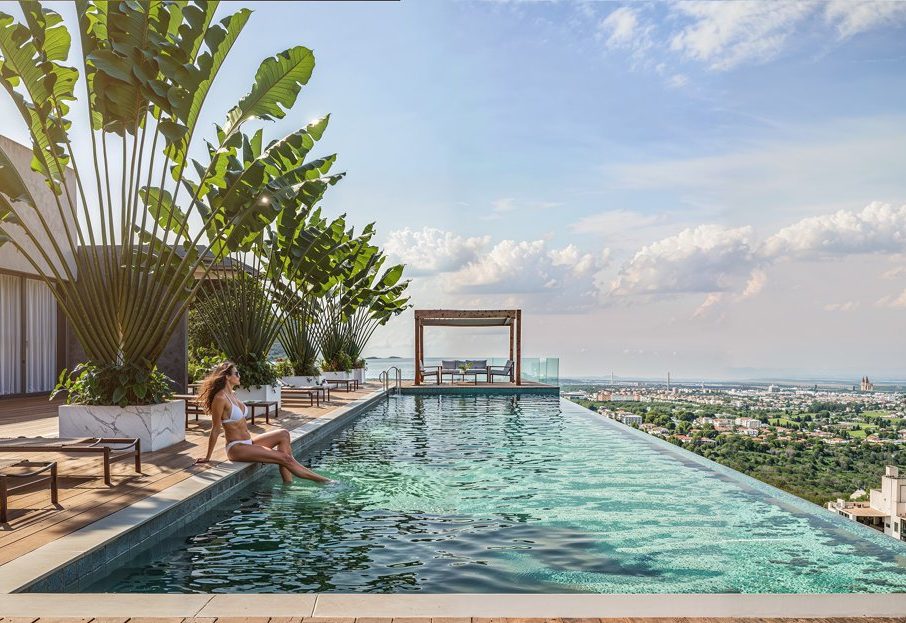 Infinity pool with city view, featured rooftop render